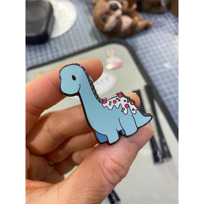 Zoe’s Fancy Cakes Dino pin - Tiffany colour